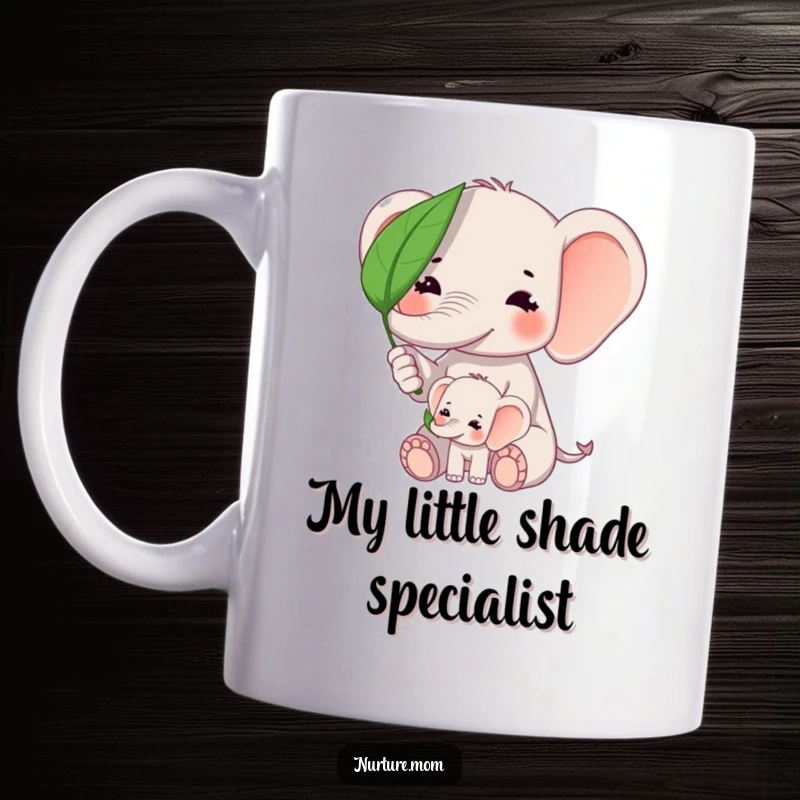 Funny kawaii elephant mom shielding baby elephant from sun with a leaf on a ceramic mug.