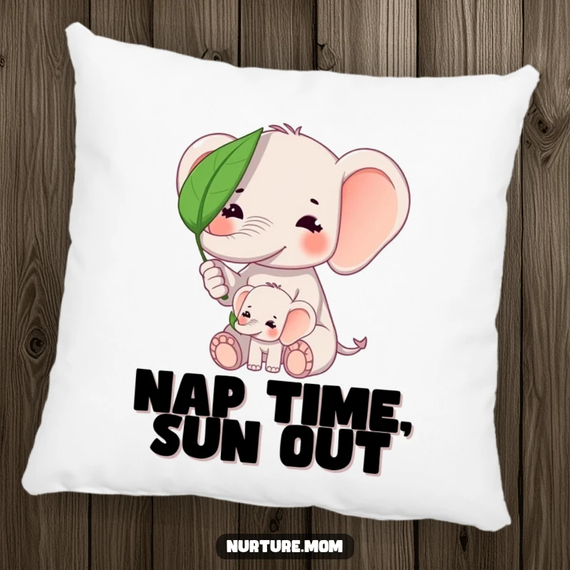 Funny kawaii elephant mom shielding baby elephant from sun with a leaf on a soft decorative pillow.