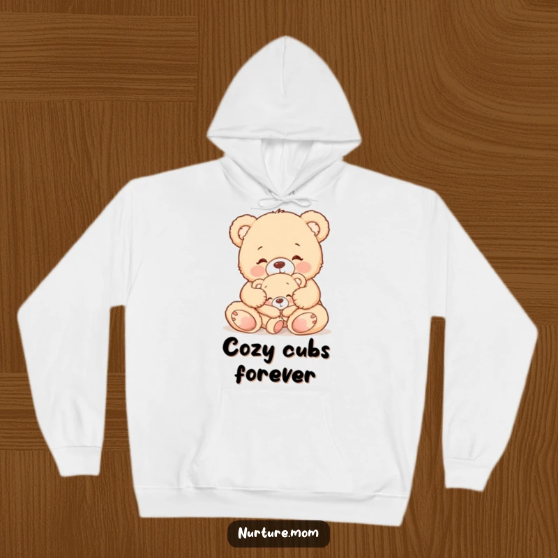 Funny hoodie showcasing a cute teddy bear mom gently tucking in her sleepy baby bear, symbolizing warmth and maternal care.
