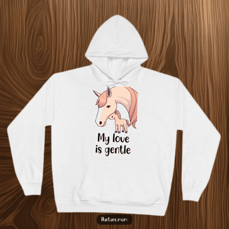 Hoodie design featuring a mother horse softly nudging her foal, symbolizing gentle care and warmth.