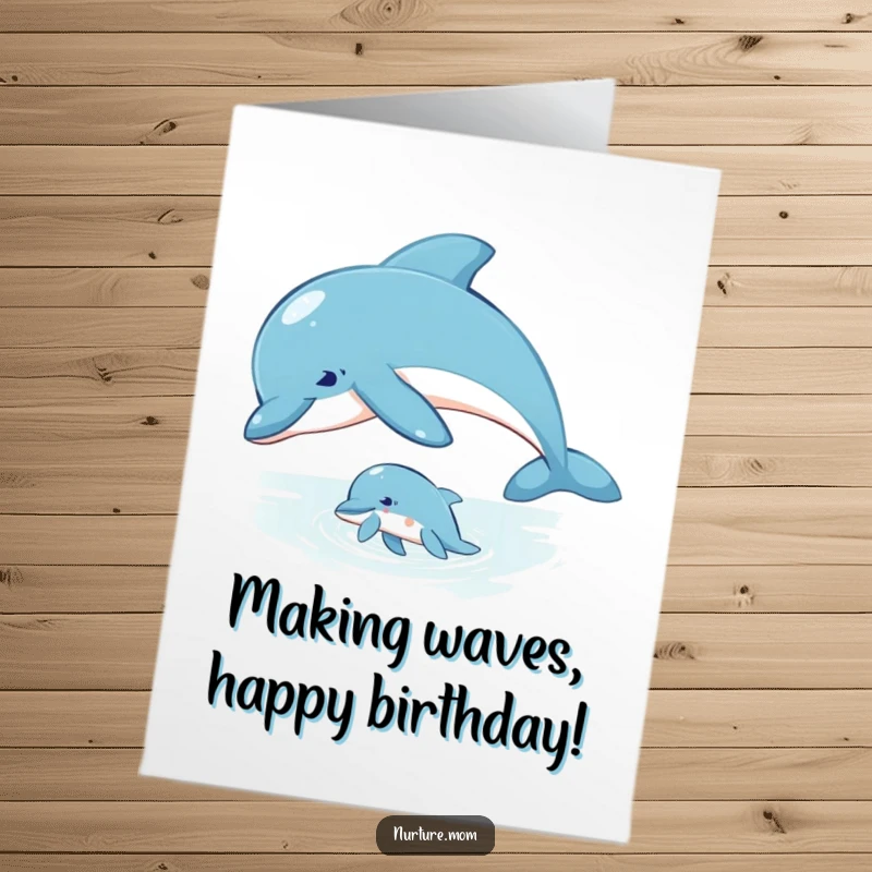 Fun Free Printable Birthday Card: Mother dolphin patiently guides her young calf through the water.