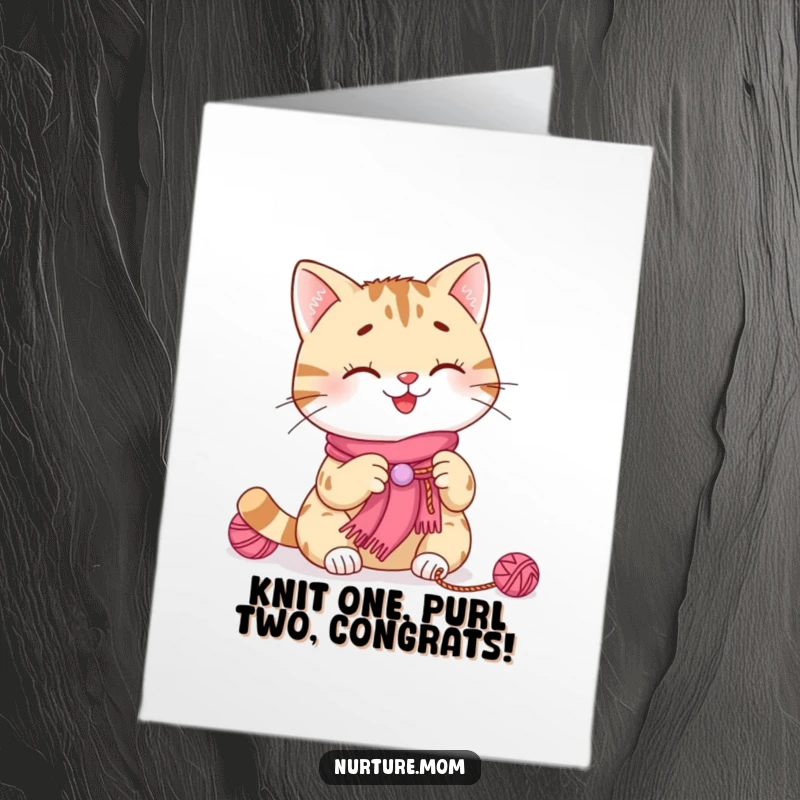 Funny free printable congratulations card featuring a smiling cat knitting a tiny scarf with yarn for them.