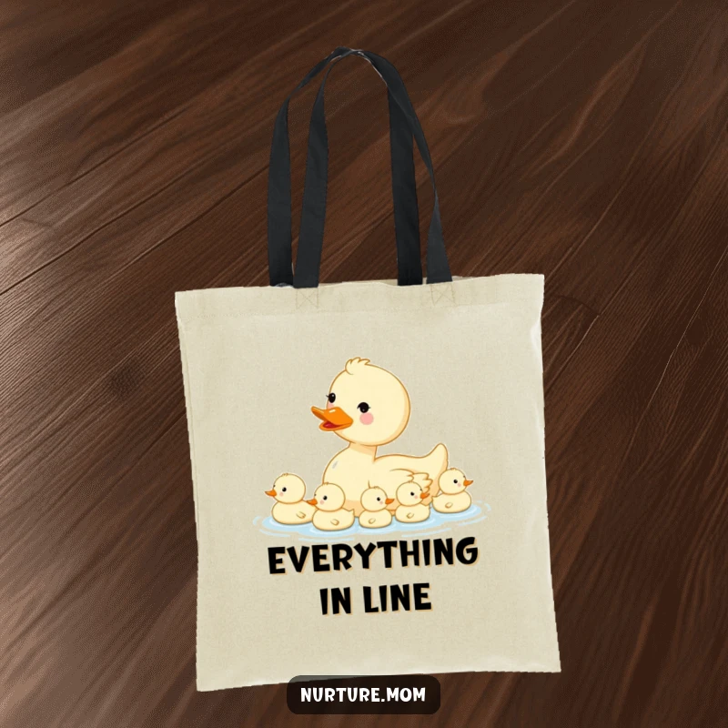 Funny kawaii mama duck leading her ducklings in a row, printed on an eco-friendly tote bag.