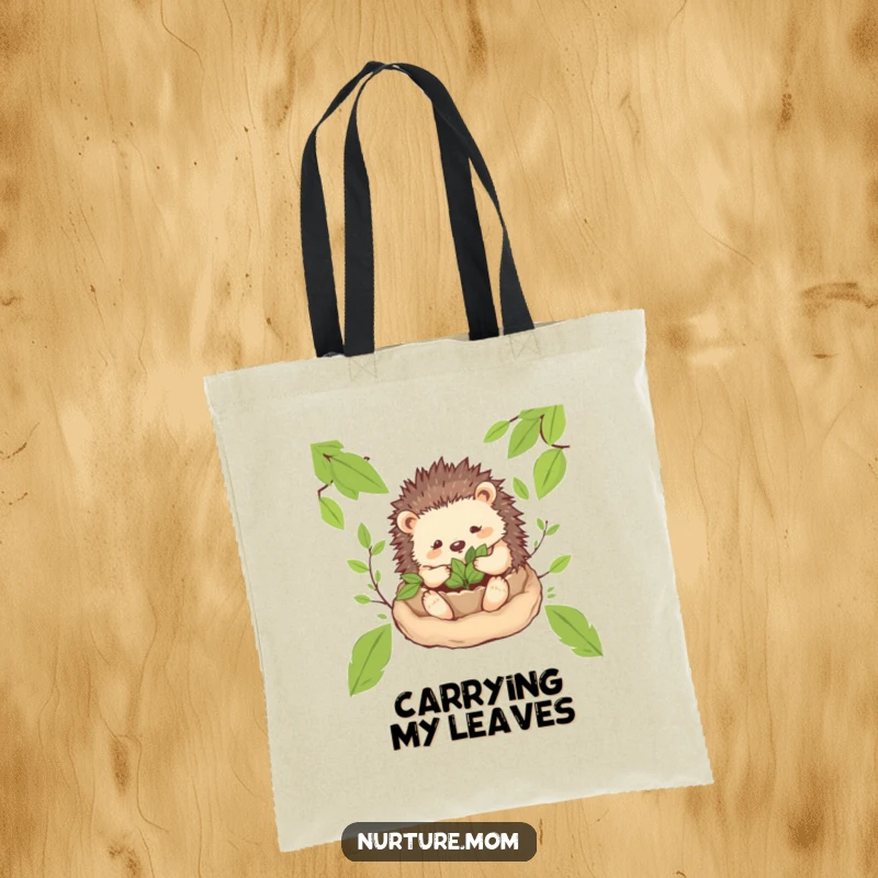 Funny! Hedgehog mom creating a cozy nest of leaves on a tote bag, perfect for carrying items with gentle charm and a hint of humor.